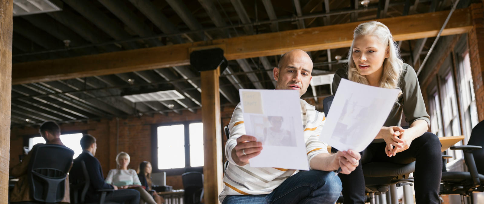 People looking at paper