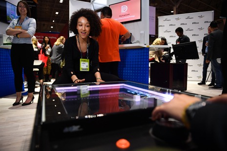 A Collision 2019 attendee plays on the Atari Pong Table, which was brought to market by Markham-based UNIS Technology.