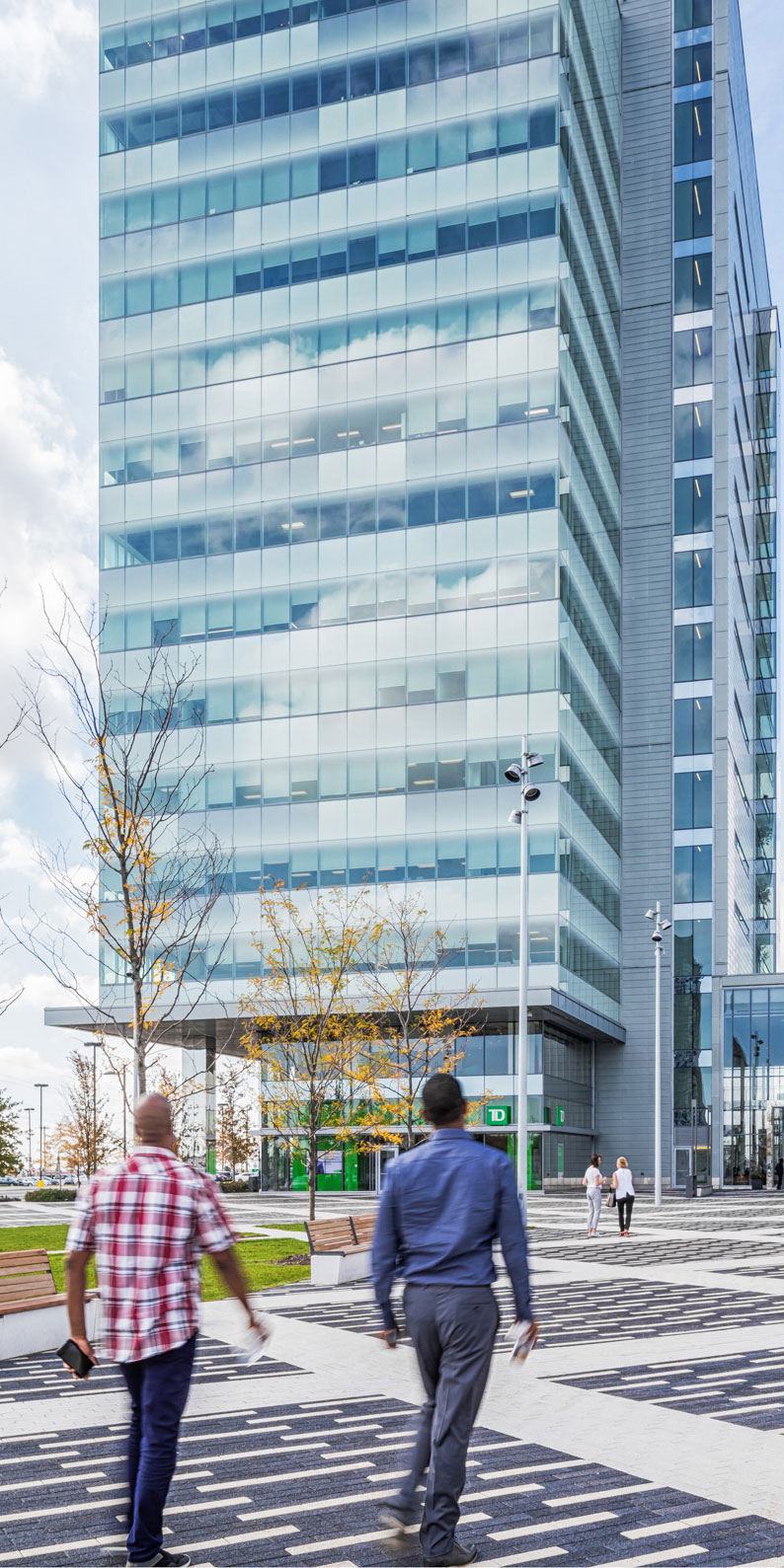 Two men in front of KPMG Tower