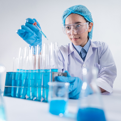 Scientist working with Beakers