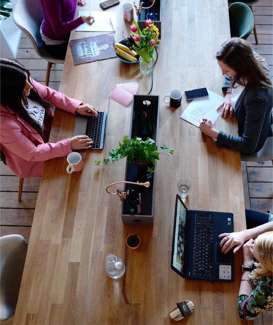 People Working at a Shared Table