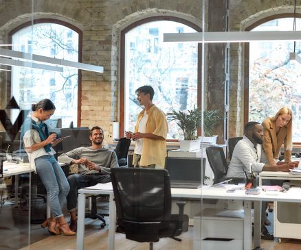 Successful team at work. Group of mixed race business people working together in the creative office This is a decorative photo workspace