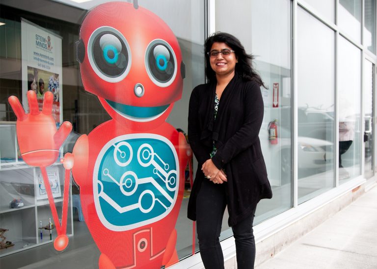 Image of Anu next to her company logo