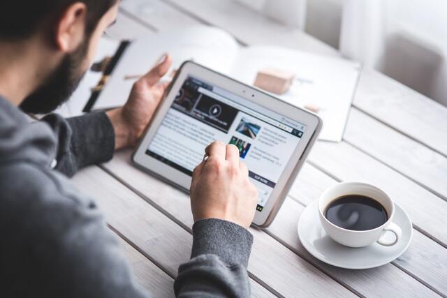 Image of man using a tablet