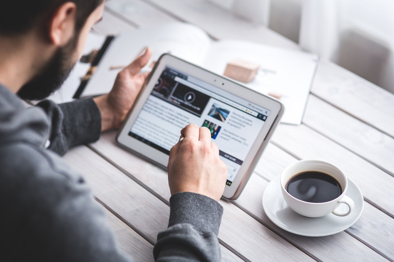 Image of man using a tablet