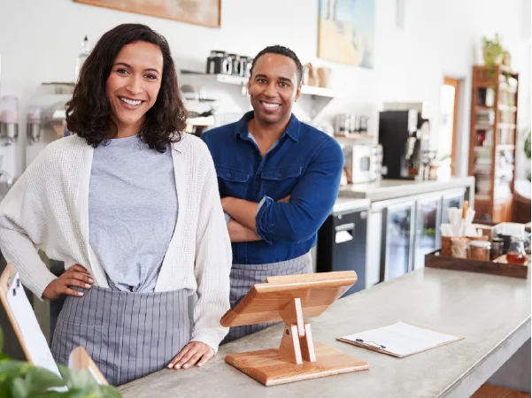 image of two small business owners standing behind a counter