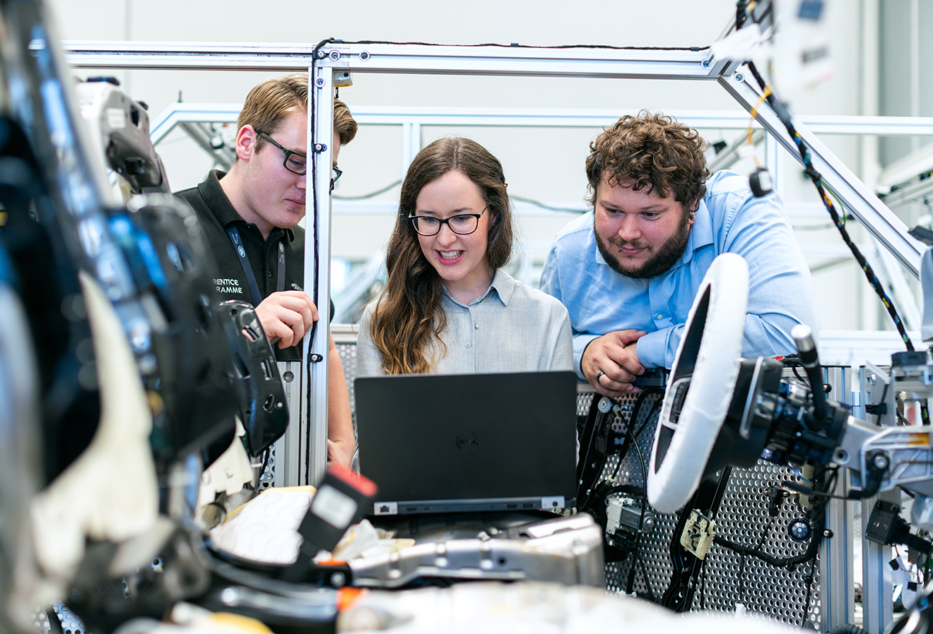 People Working on Car Technology