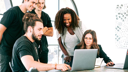 People Looking at a laptop