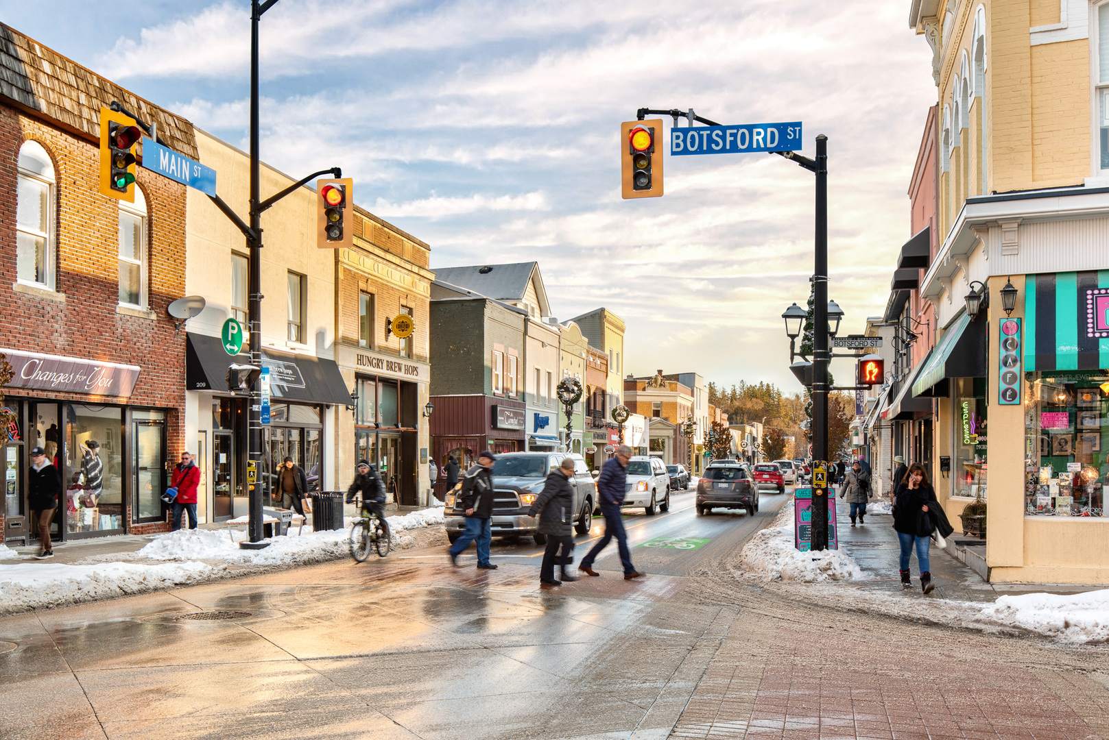 Main Street Newmarket in the winter with people crossing the street
