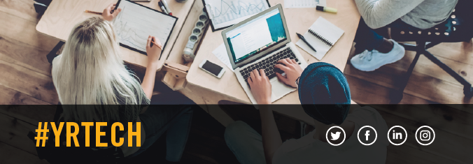 A group of entrepreneurs working together at an office desk.