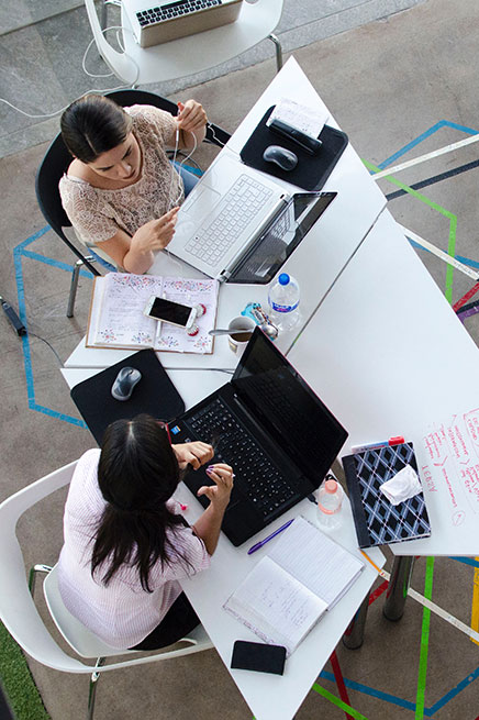 Women professionals collaborating at a table