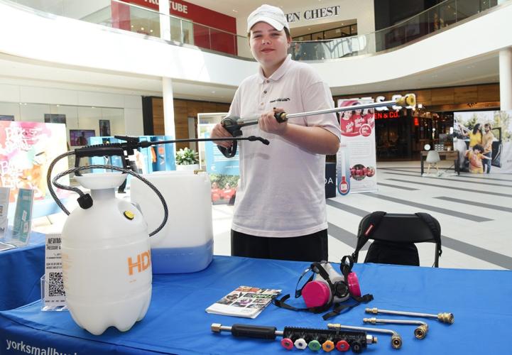 Golden Stickwood at Upper Canada Mall in Newmarket promoting his Summer Company Pressure Washing business.