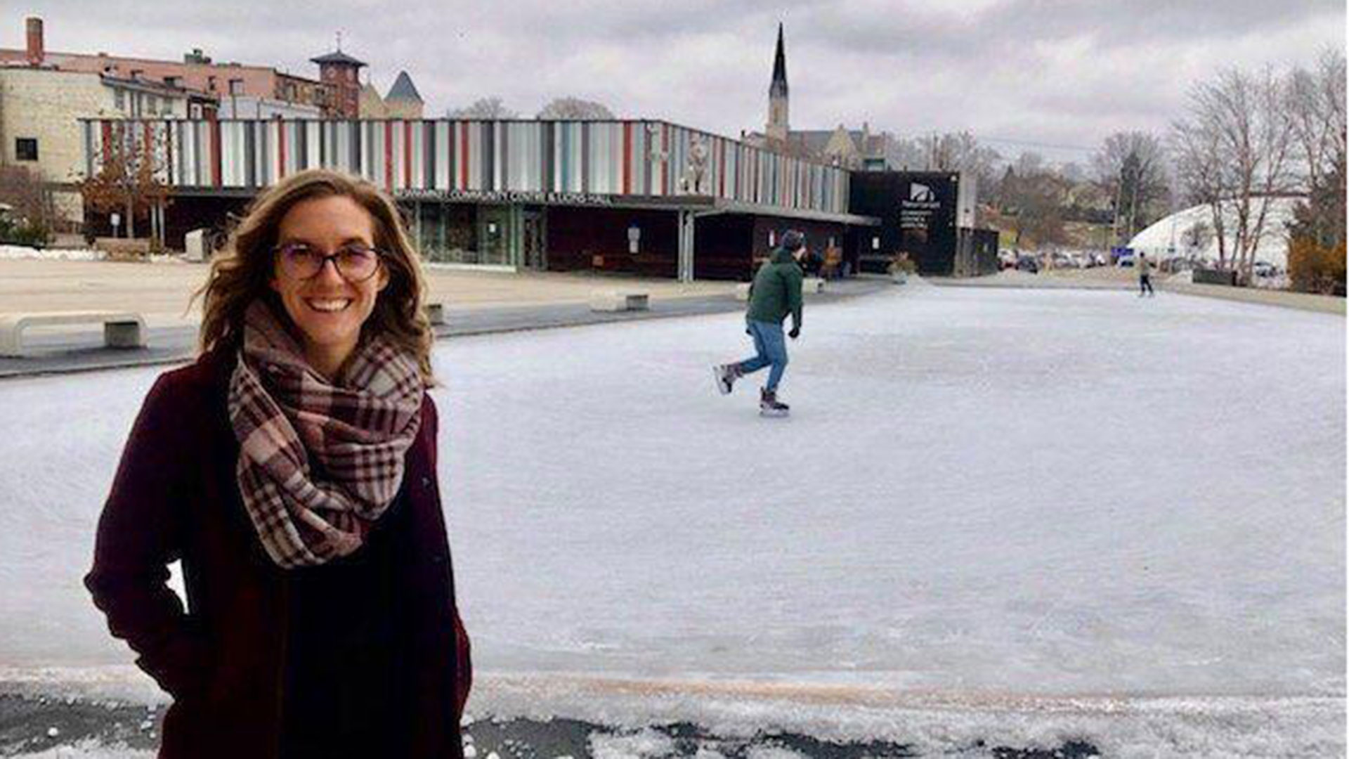 Elizabeth Hawkins in front of Riverwalk Commons